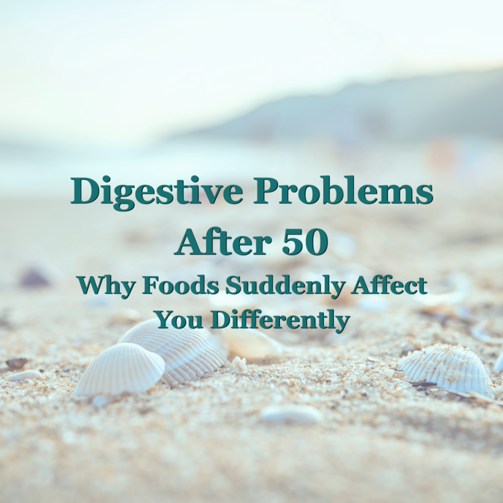 Digestive Problems After 50: Why Foods Suddenly Affect You Differently” featured image showing seashells on a beach with soft teal text overlay, representing gut health and digestive changes with ageing.